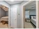Hallway view showing doorways to two bedrooms, carpet and ceiling fans at 141 S Fairfield Dr, Peachtree City, GA 30269
