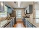 Well-appointed kitchen with stainless steel appliances, granite countertops, and ample cabinet space at 141 S Fairfield Dr, Peachtree City, GA 30269