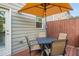 Cozy back deck with umbrella-covered dining table, perfect for outdoor entertaining at 2444 Coosa Vly, Atlanta, GA 30339