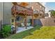 Backyard with outdoor seating on the patio, a deck above, and a well-maintained lawn at 2444 Coosa Vly, Atlanta, GA 30339