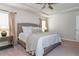 Bright bedroom featuring a tray ceiling and natural lighting from windows at 2444 Coosa Vly, Atlanta, GA 30339