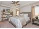 Cozy bedroom features a tray ceiling, neutral decor, and a comfortable queen-sized bed at 2444 Coosa Vly, Atlanta, GA 30339