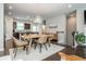 Bright dining space with views into the open kitchen and a staircase to the upper level at 2444 Coosa Vly, Atlanta, GA 30339