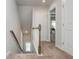 Bright stairway and hallway leads to bedroom with natural light from window at 2444 Coosa Vly, Atlanta, GA 30339
