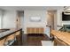 Open floor plan features kitchen island seating, seamlessly connecting the kitchen and living spaces at 2444 Coosa Vly, Atlanta, GA 30339
