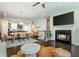 Inviting living room with a fireplace, mounted TV, and adjacent dining area and kitchen at 2444 Coosa Vly, Atlanta, GA 30339