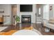 Inviting living space features a fireplace, hardwood floors, and large windows at 2444 Coosa Vly, Atlanta, GA 30339