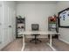 Office space featuring football decor, a bright window, and a spacious desk and comfortable chair at 2444 Coosa Vly, Atlanta, GA 30339