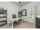 Office space featuring football decor, a bright window, and a spacious desk and comfortable chair at 2444 Coosa Vly, Atlanta, GA 30339