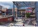 Outdoor plaza view featuring gathering areas, retail buildings, and public art on a sunny day at 2444 Coosa Vly, Atlanta, GA 30339
