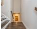 Staircase with wooden steps and white risers, leading to a lower level with a decorative wall at 2444 Coosa Vly, Atlanta, GA 30339