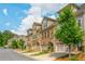 Charming townhomes with manicured lawns line a peaceful street at 2444 Coosa Vly, Atlanta, GA 30339