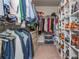 Organized walk-in closet features custom shelving, hanging racks, and ample storage for clothes and accessories at 2444 Coosa Vly, Atlanta, GA 30339