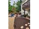 Spacious backyard with a hot tub, patio area, and a variety of seating arrangements at 365 Autumn Breeze Dr, Roswell, GA 30075