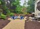 Inviting backyard with a charming fire pit and comfortable seating area for outdoor gatherings at 365 Autumn Breeze Dr, Roswell, GA 30075