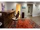 Basement bar area with a wooden bar, seating, and decorative rugs and flooring at 365 Autumn Breeze Dr, Roswell, GA 30075