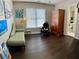 Well-lit bedroom features hardwood floors, neutral paint and a traditional armoire at 365 Autumn Breeze Dr, Roswell, GA 30075