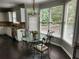 Sunlit breakfast nook with a glass-top table and seating area, perfect for enjoying morning meals at 365 Autumn Breeze Dr, Roswell, GA 30075
