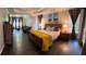 Spacious main bedroom with trey ceiling, sitting area, hardwood floors and natural light at 365 Autumn Breeze Dr, Roswell, GA 30075