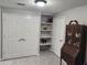 Home office with large closet, built-in shelving, and antique desk at 365 Autumn Breeze Dr, Roswell, GA 30075