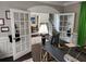 Sunlit office with glass panel doors leading to other rooms at 365 Autumn Breeze Dr, Roswell, GA 30075