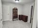 Home office features a dark wood desk, matching cabinets, and neutral-colored tile flooring at 365 Autumn Breeze Dr, Roswell, GA 30075