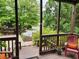 Inviting front porch featuring wooden railings and chairs, offering a relaxing outdoor space at 365 Autumn Breeze Dr, Roswell, GA 30075