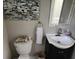 Charming powder room with elegant sink, custom mirror, decorative painting, and fixtures at 365 Autumn Breeze Dr, Roswell, GA 30075