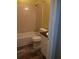 Cozy bathroom with tub, tiled walls, and updated wood-look flooring, blending comfort and functionality at 3820 London Dr Dr, Decatur, GA 30032