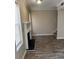 Inviting living room featuring a classic fireplace, wood-look floors, and bright windows, blending comfort with style at 3820 London Dr Dr, Decatur, GA 30032