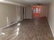 Spacious living room with wood-look floors, offering an open and inviting space for relaxation and entertainment at 3820 London Dr Dr, Decatur, GA 30032