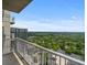 Balcony view overlooking green landscape with city buildings against a blue sky at 855 Peachtree Ne St # 2713, Atlanta, GA 30308