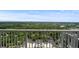 Balcony view of lush greenery and the Atlanta skyline with blue skies at 855 Peachtree Ne St # 2713, Atlanta, GA 30308