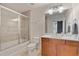 Bathroom featuring a glass enclosed tub-shower with matching marble vanity at 855 Peachtree Ne St # 2713, Atlanta, GA 30308