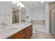 Double sink bathroom featuring a glass shower and tub combination at 855 Peachtree Ne St # 2713, Atlanta, GA 30308
