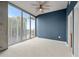 Bedroom offering floor-to-ceiling windows with city views and concrete design at 855 Peachtree Ne St # 2713, Atlanta, GA 30308