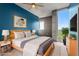 Bright bedroom with a bed, ceiling fan, and large windows with city views at 855 Peachtree Ne St # 2713, Atlanta, GA 30308