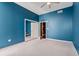 Bedroom featuring carpet flooring and blue accent wall at 855 Peachtree Ne St # 2713, Atlanta, GA 30308