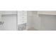 Walk-in closet with built-in shelving and drawers for optimal organization at 855 Peachtree Ne St # 2713, Atlanta, GA 30308