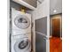Efficient laundry area featuring a stacked washer and dryer for space-saving convenience at 855 Peachtree Ne St # 2713, Atlanta, GA 30308