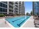 The rooftop pool features a relaxing retreat with lounge chairs and city views at 855 Peachtree Ne St # 2713, Atlanta, GA 30308