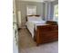 Cozy bedroom with neutral tones, featuring a wooden dresser and ample natural light at 1624 Beecher Sw St, Atlanta, GA 30310
