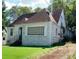 Charming brick home featuring a traditional roof, well-manicured lawn, and inviting front entrance at 1624 Beecher Sw St, Atlanta, GA 30310