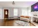 Inviting living room showcasing hardwood floors, natural light, and a decorative fireplace feature at 1624 Beecher Sw St, Atlanta, GA 30310