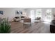 Cozy living room with lots of natural light, hard wood floors, and neutral walls at 4964 Villager Ln, Stone Mountain, GA 30083
