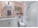 Charming bathroom features white subway tile, marble countertop, and a shower over tub at 5 Newport Nw Pl, Atlanta, GA 30318