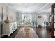Charming dining room with a round table, white chairs, and a modern pendant light at 5 Newport Nw Pl, Atlanta, GA 30318