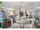 Open concept dining area next to kitchen and living room, featuring modern chandelier at 5 Newport Nw Pl, Atlanta, GA 30318