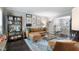 Inviting living room with a comfortable leather sectional, stylish decor, and hardwood floors at 5 Newport Nw Pl, Atlanta, GA 30318