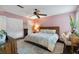 Spacious main bedroom with a ceiling fan, hardwood floors, and neutral walls at 5 Newport Nw Pl, Atlanta, GA 30318